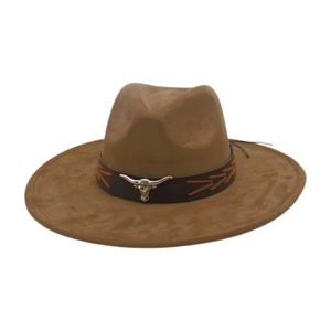 Detail of a brown suede western hat featuring a silver bull head on a leather band
