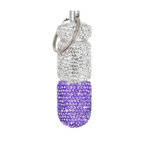Macro detail of purple and silver rhinestone pill container with keychain metal hook