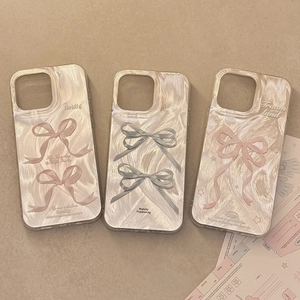 Detail of 3D bow smartphone cases with pearlescent texture and inspirational quotes