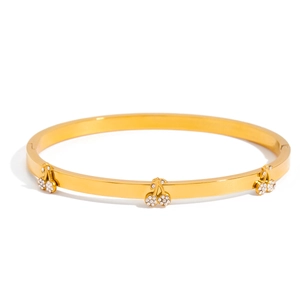 Detail of gold-plated stainless steel bangle featuring sparkling crystal cherry charms