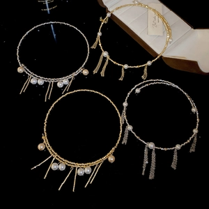 Detailed view of pearl tassel choker necklaces with metal bars in gold and silver finishes