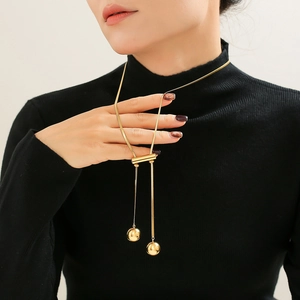 18K gold plated sweater chain featuring hollow round beads and a sleek long tassel pendant