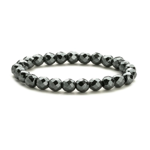 Macro detail of elastic beaded bracelet with faceted black volcanic natural stone beads