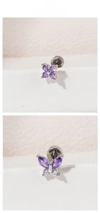 Detail showing purple zircon heart and butterfly screw back titanium steel ear studs