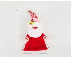 Detail of knitted Santa Claus gift bag showing 34cm height and 17cm width dimensions
