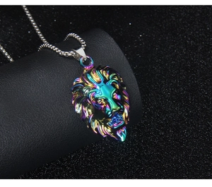 Detailed macro view of a rainbow lion head pendant made of polished stainless steel metal