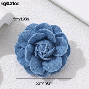 Detail view of blue denim rose brooch showing dimensions 5cm and 6g weight on white background