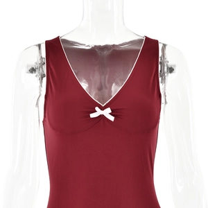 Detailed close-up of wine red V-neck dress featuring delicate white lace trim and bow knot