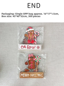 Detail view of two wooden gingerbread man Christmas ornaments with 'Oh Boy!' and 'Merry Christmas'