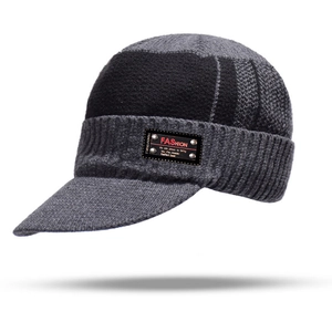Detail of color-block knit visor beanie with fashion patch and thick ribbed texture