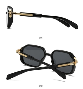 Détail des branches en métal doré avec textures verticales sur lunettes aviateur noires