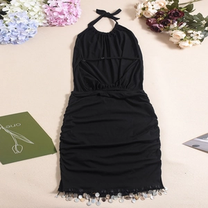Flat lay of a black halter mini dress featuring shimmering metallic sequin fringe details