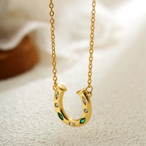 18K gold horseshoe necklace with green zircon pendant on stainless steel chain