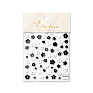 Detail of thin black and white floral 5D nail stickers in Tomoni retail packaging