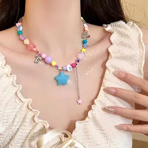 Detail of Y2K colorful beaded necklace with large blue star pendant and charms