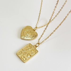 Golden 925 silver coin necklaces with heart and rectangle pendants on white background