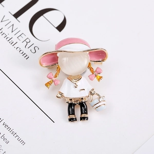 Detailed view of creative alloy brooch featuring a cartoon girl with pink hat and rhinestones