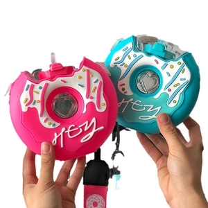 Pink and blue donut-shaped kids water bottles with straws and silicone covers