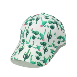 Close-up of white baseball cap with green cactus pattern and six-panel cotton texture