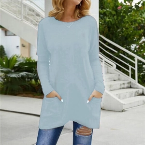 Light blue long-sleeved crewneck t-shirt with two front pockets on a model