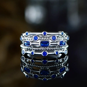 Fashion multi-layer silver ring set with deep blue emerald-cut gemstones and twisted band