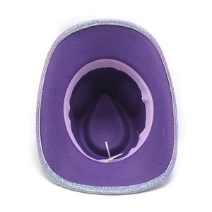 Detail view of purple felt cowboy hat featuring silver glitter trim on the wide brim