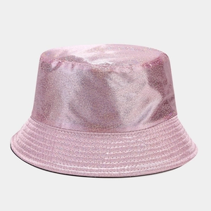 Detail shot of the pink glitter texture on a shiny PU leather reversible bucket hat