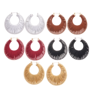Five pairs of woven texture geometric hoop earrings in assorted metallic finishes