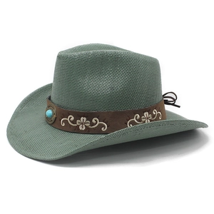Close-up of sage green straw cowboy hat with embroidered brown band and turquoise bead