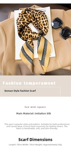 Detail view of leopard print silk scarf measuring 70x70cm on a stylish blazer