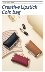 Close-up of vintage leather coin purses in black, brown and burgundy with gold metal clasps