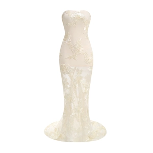 Intricate floral lace embroidery detail on elegant beige strapless fishtail evening gown