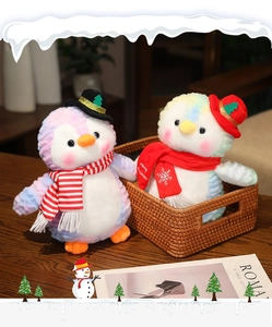 Close-up of pastel tie-dye Christmas penguin plush in a rustic wicker basket