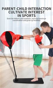 Father assisting child with adjustable upright punching bag in a bright home setting