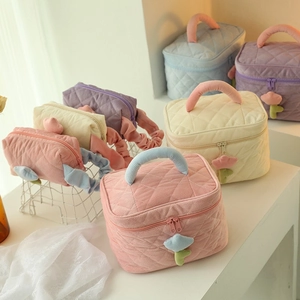 Pastel corduroy quilted makeup bags with floral zipper charms in multiple colors