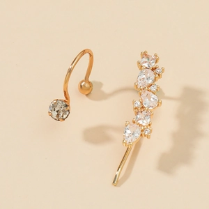 Close-up of gold-plated leaf and star ear cuff set with white zircon stones