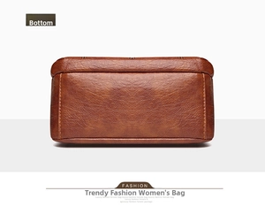 Detail view of the rectangular flat bottom of the brown leather shoulder bag