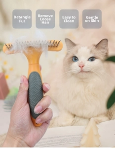Detail of metal rake comb removing loose fur from a cat for effective grooming
