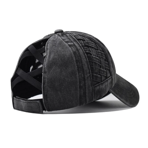 Detail of the elastic criss-cross ponytail hole and washed cotton texture on baseball cap