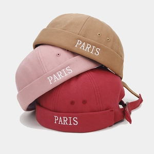 Detailed embroidery of PARIS on khaki, pink, and red cotton brimless Miki hats