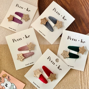 Velvet star hair clip set for kids in 5 colors featuring glitter details on card