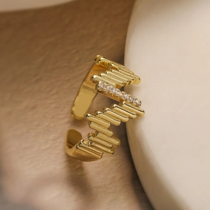Zircon wave ring with gold plating and adjustable opening in a minimalist design