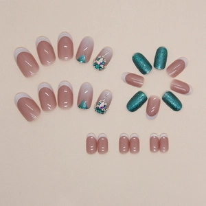Oval French press-on nails set featuring emerald green gems and blue glitter finish