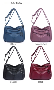Multiple color display of textured leather crossbody bags in blue, purple, black, and red