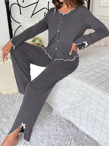 Deep gray long-sleeve pajama set featuring white ruffle trim and cute decorative bows