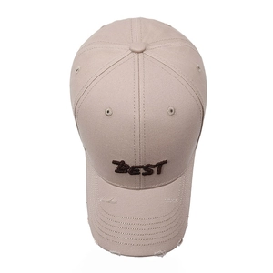 Vintage distressed beige baseball cap with BEST embroidery and worn brim details