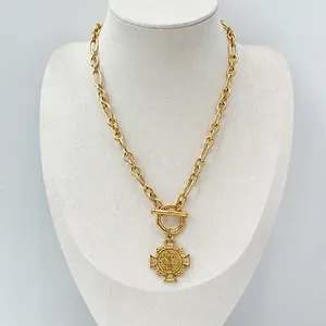 18k gold plated chunky chain necklace with OT clasp and cross coin pendant on a neck bust