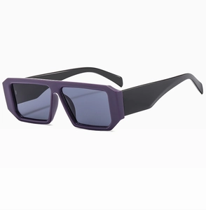 Detail view of bold purple rectangular frames and wide black temples on sunglasses
