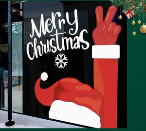 Detail of Santa hand gesture window sticker with Merry Christmas text on glass