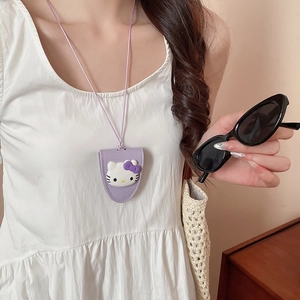 Detail of purple leather Hello Kitty pouch with a long neck strap for daily styling